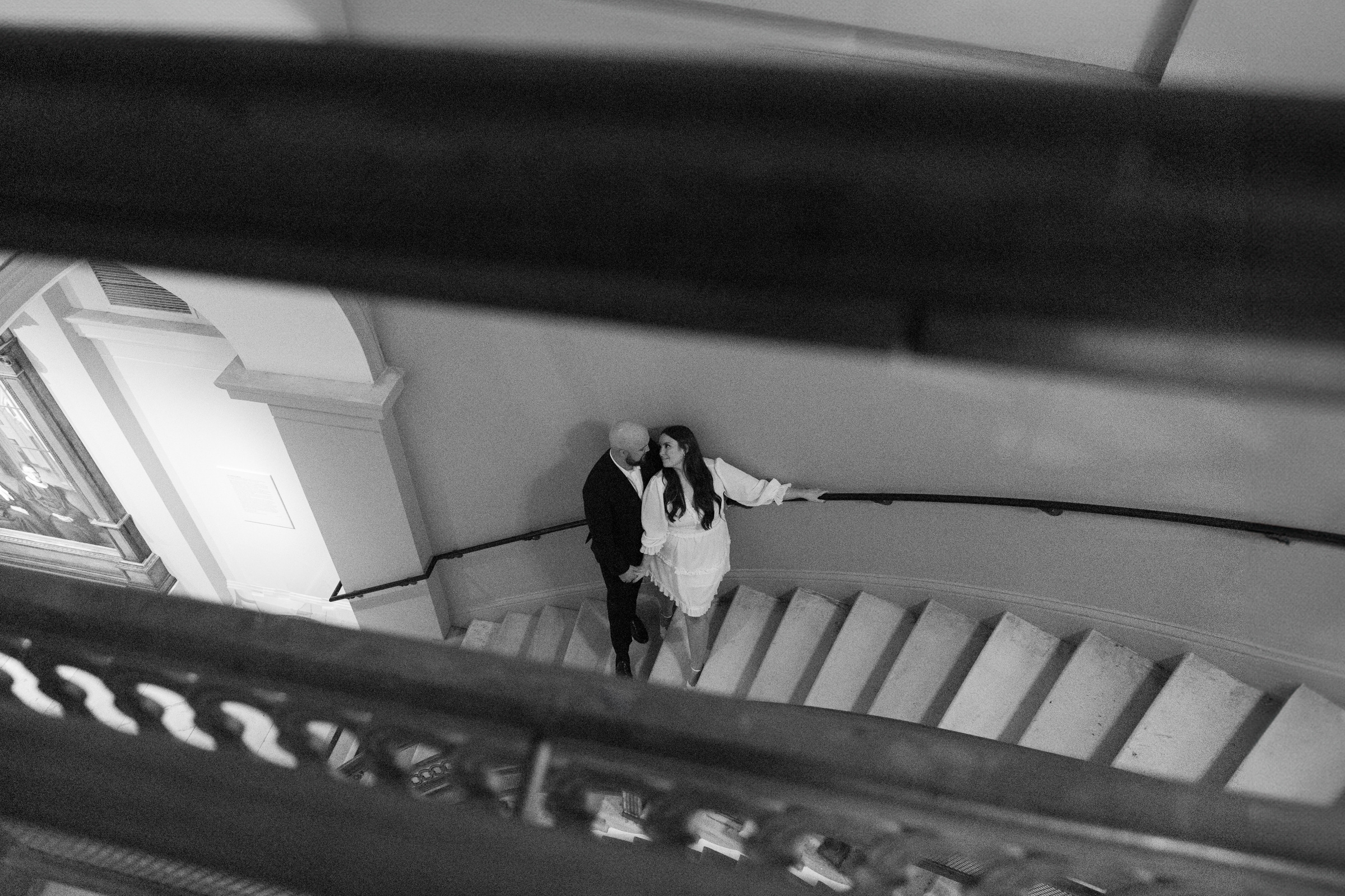 A black and white photo of a couple at the National Portrait Gallery taken by Alex McCormick Photography.