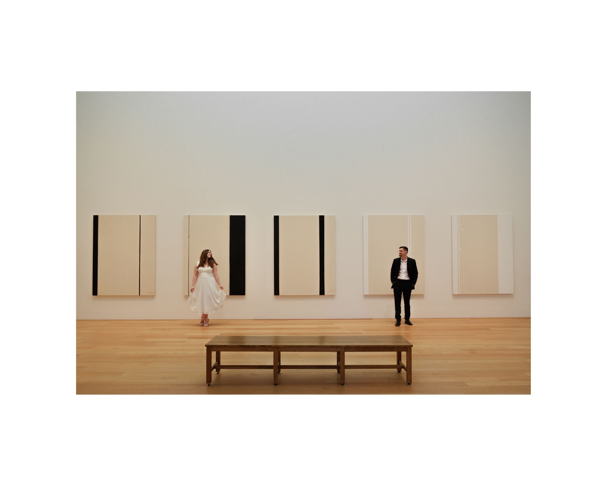 A couple stands in front of artwork at the national gallery of art