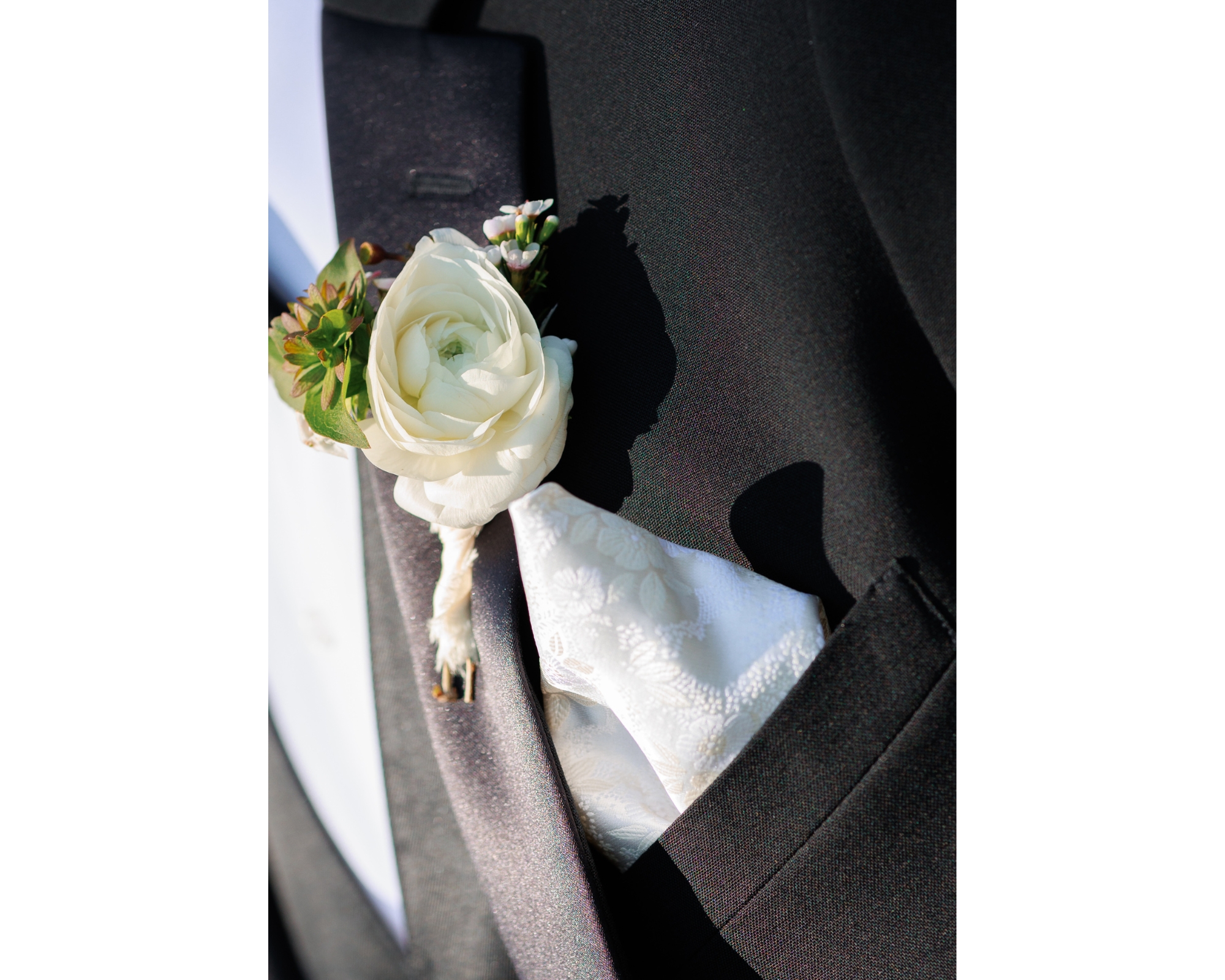 Groom details featuring a boutonniere.