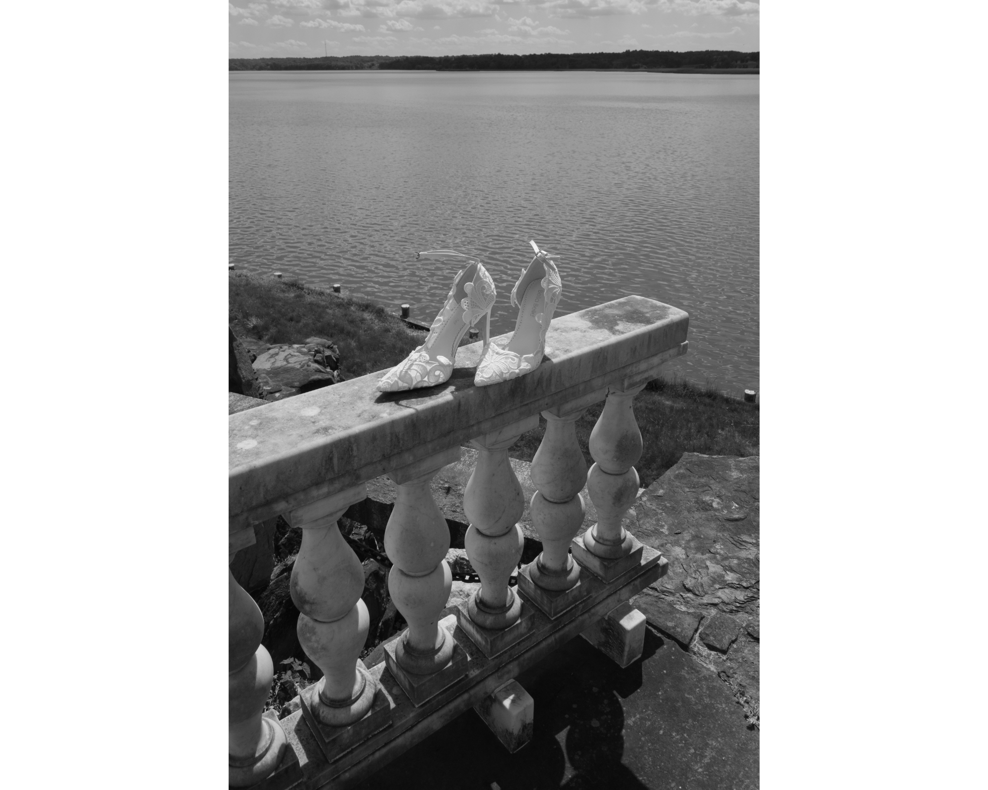 Bridal shoes atop a ledge at a private estate wedding venue.