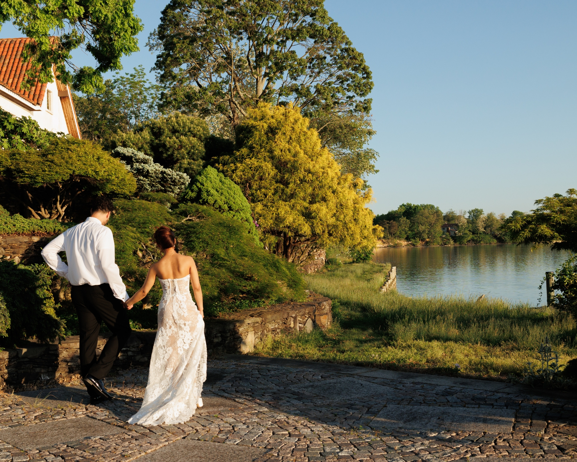 The couple walks out together for a sunset walk on the dock.