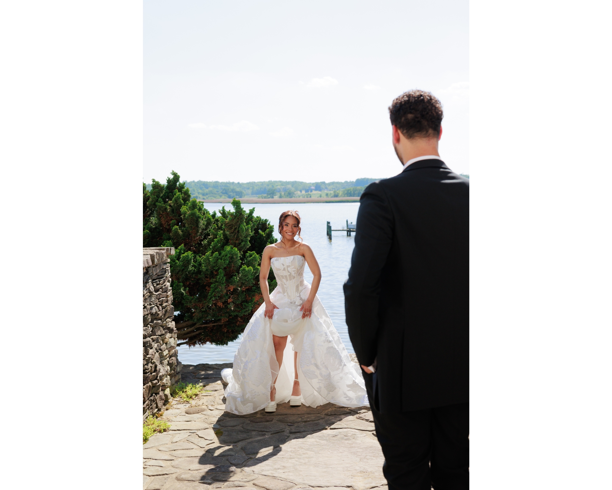 Photos of a bride walking to her groom with waterfront views.