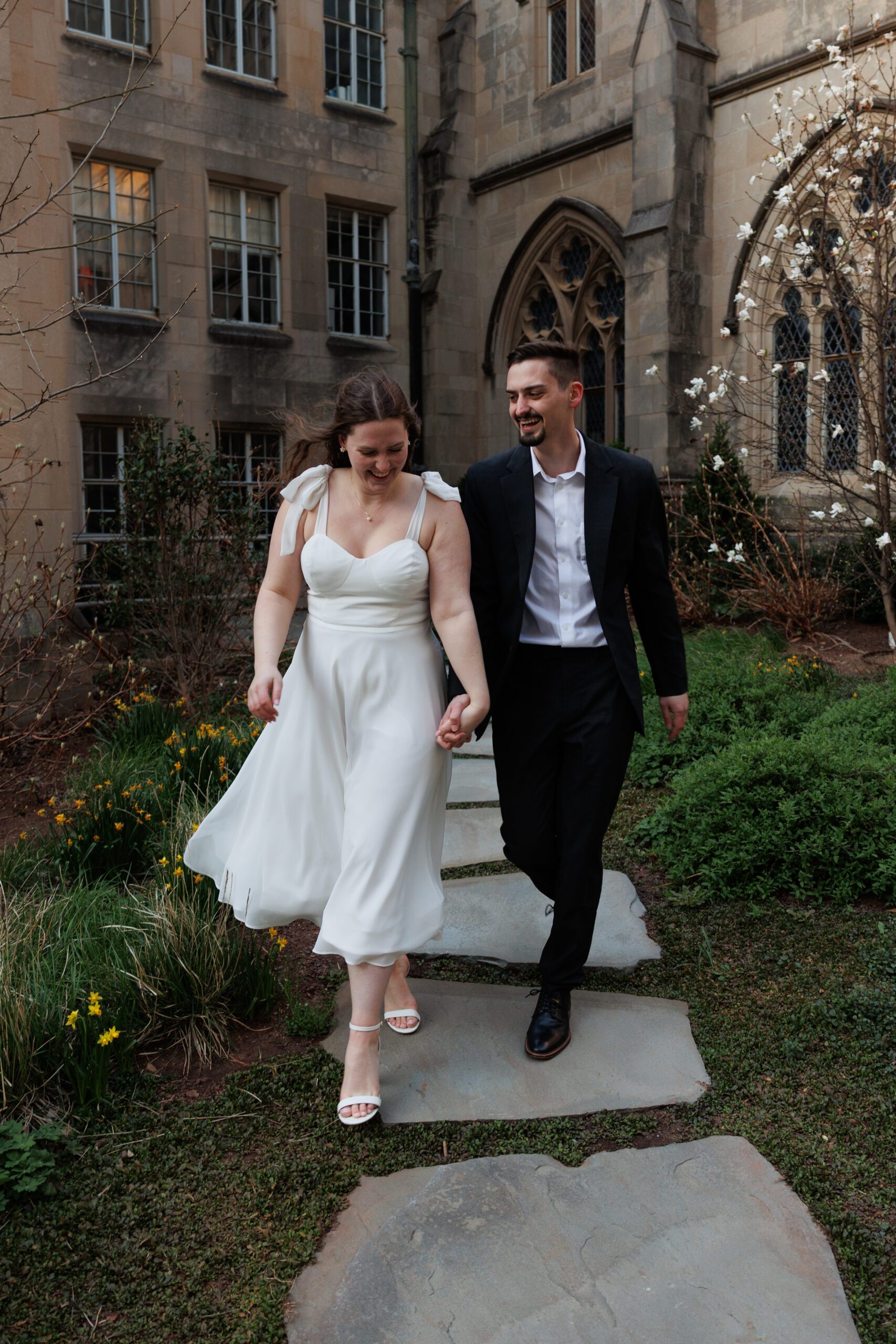 Couple walks together hand in hand.