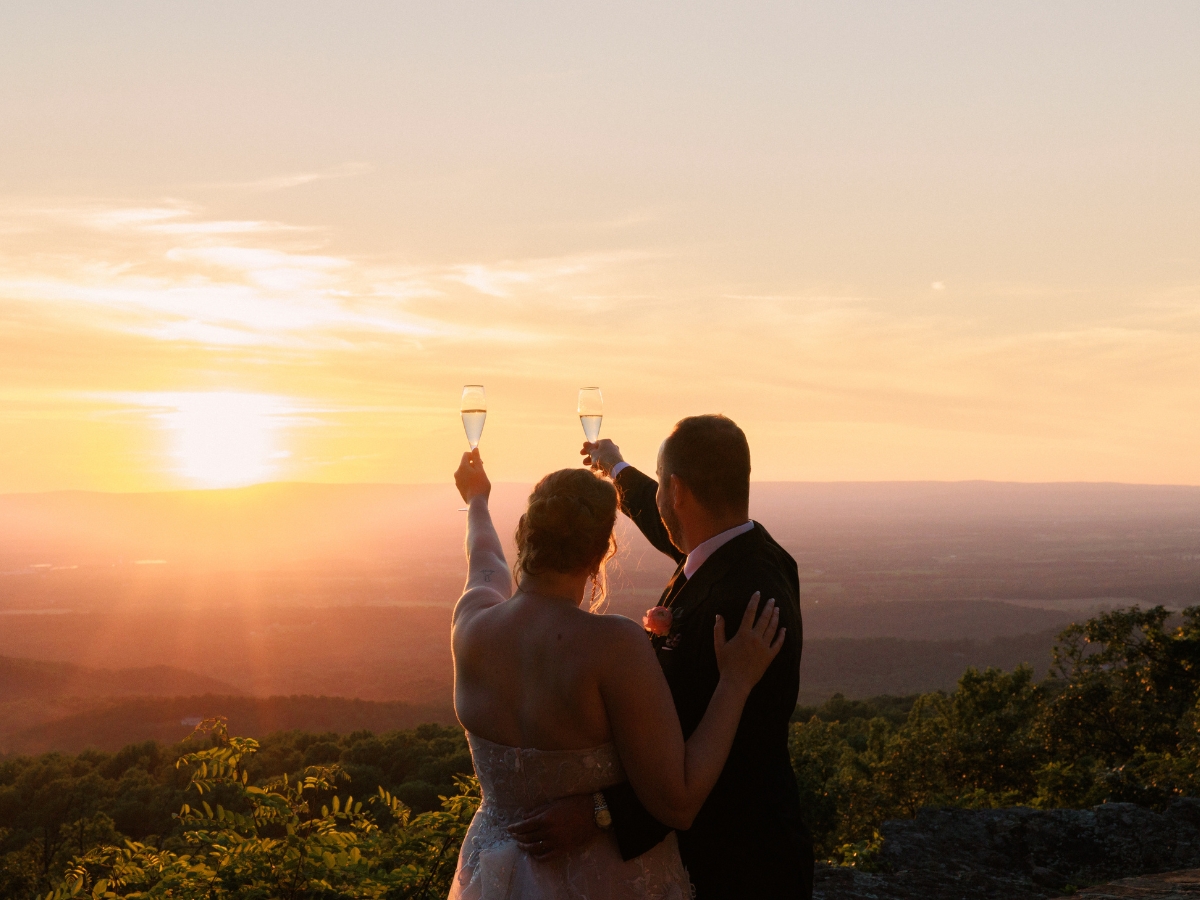 Bride and groom share champagne