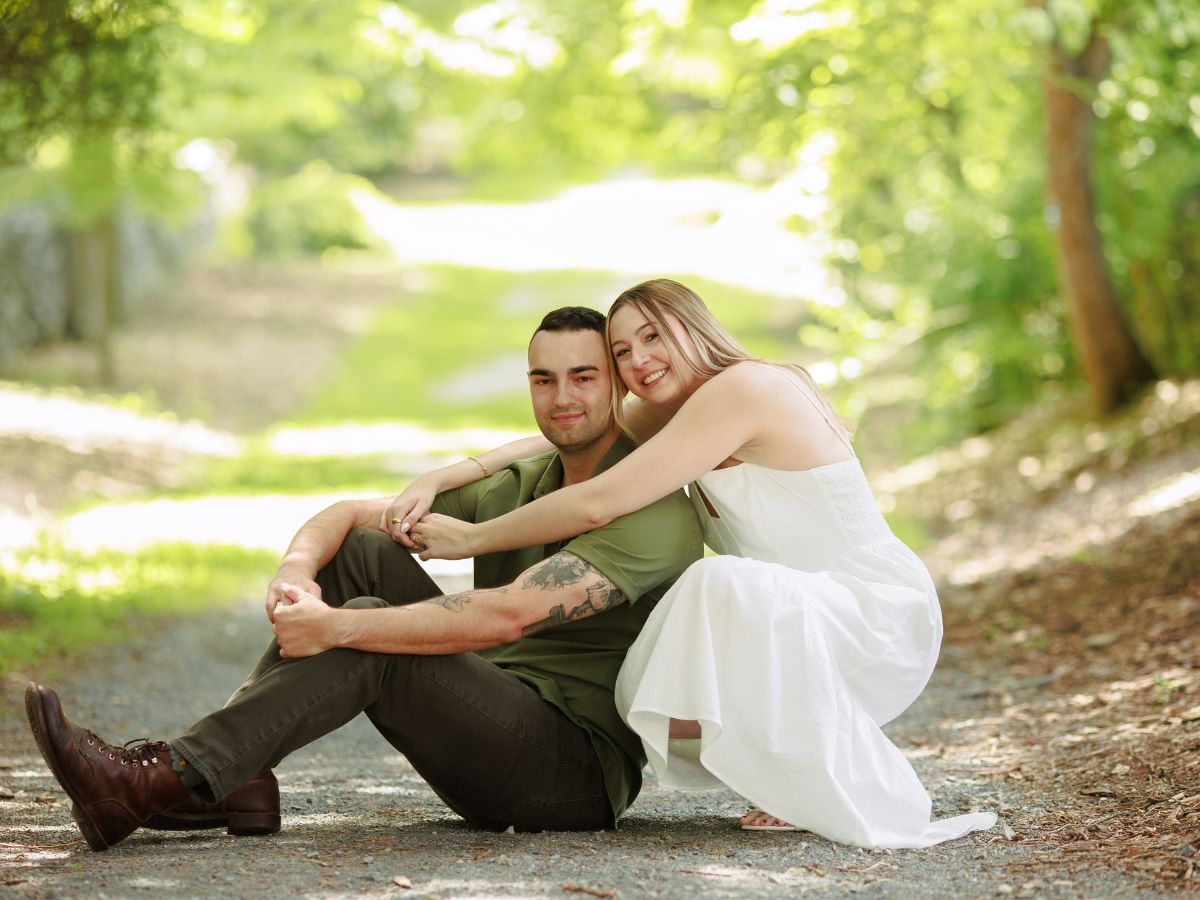 Couple in love poses together for romantic engagement photos