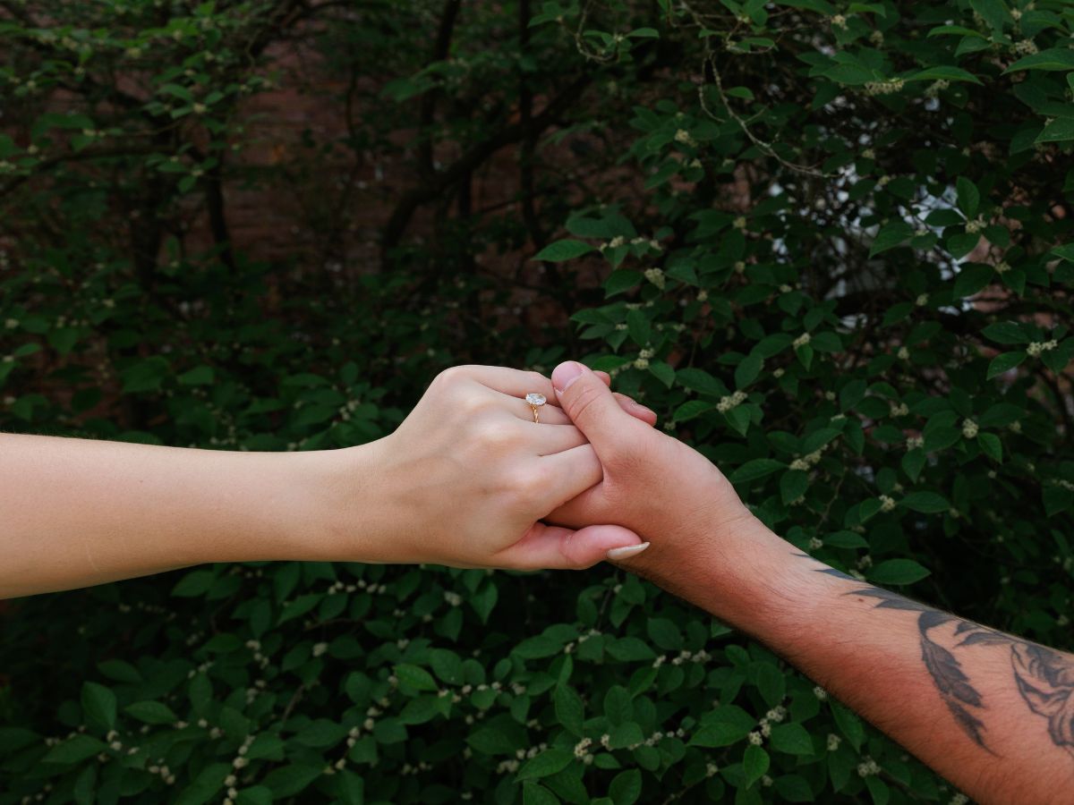 Newly engaged couple shows off the engagement ring