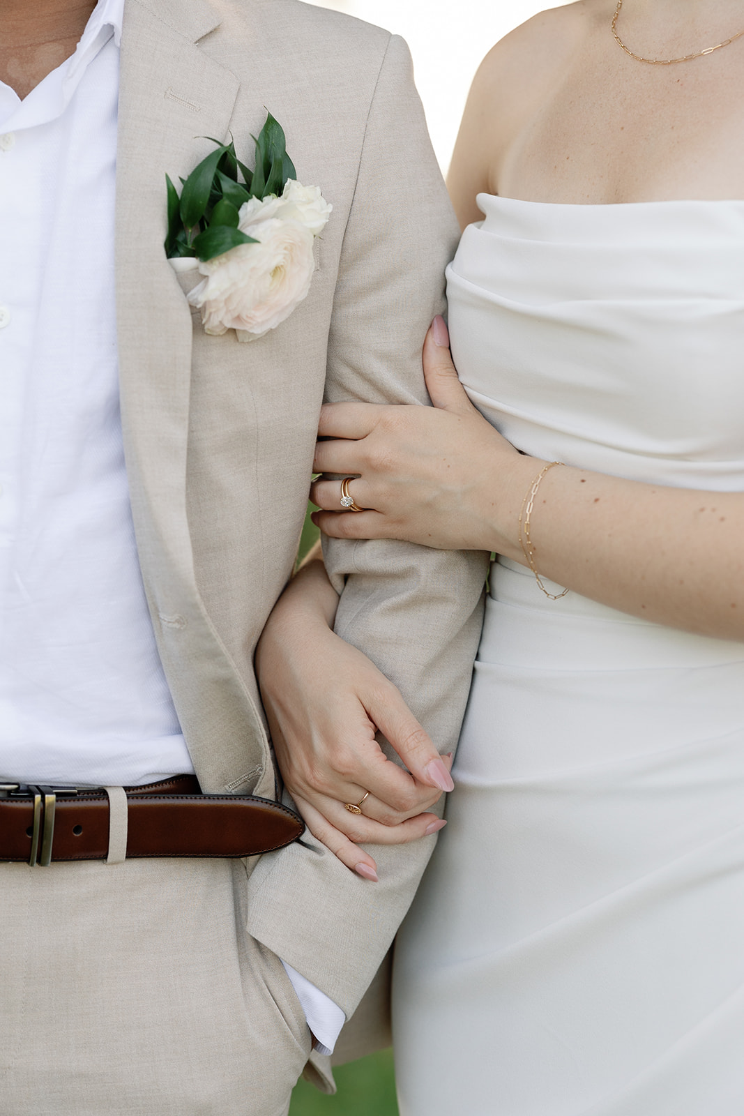 Groom wearing light linen suit at his Stone Tower Winery wedding.