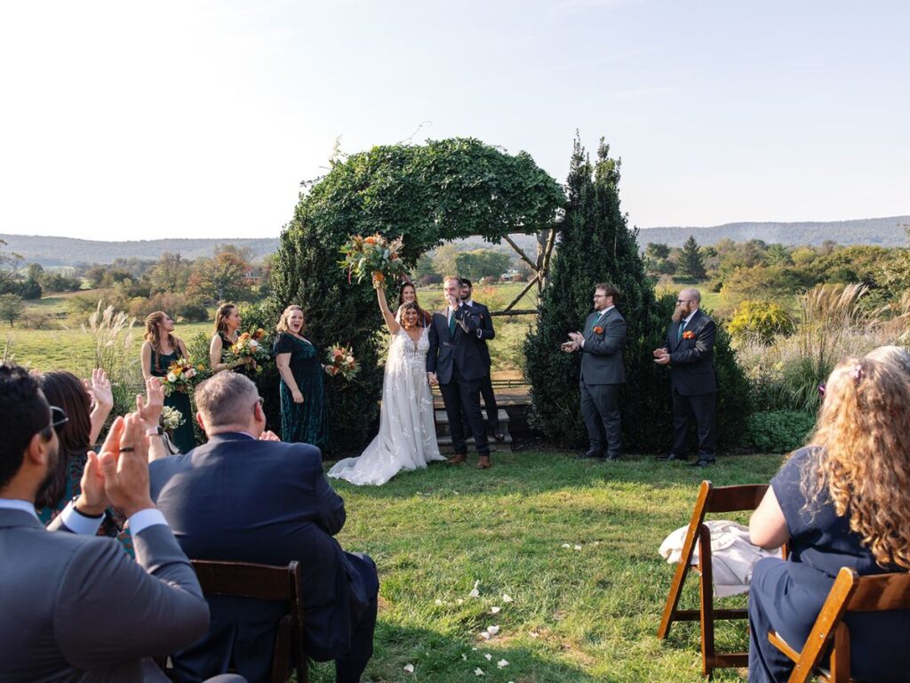 Newlyweds celebrating after their ceremony