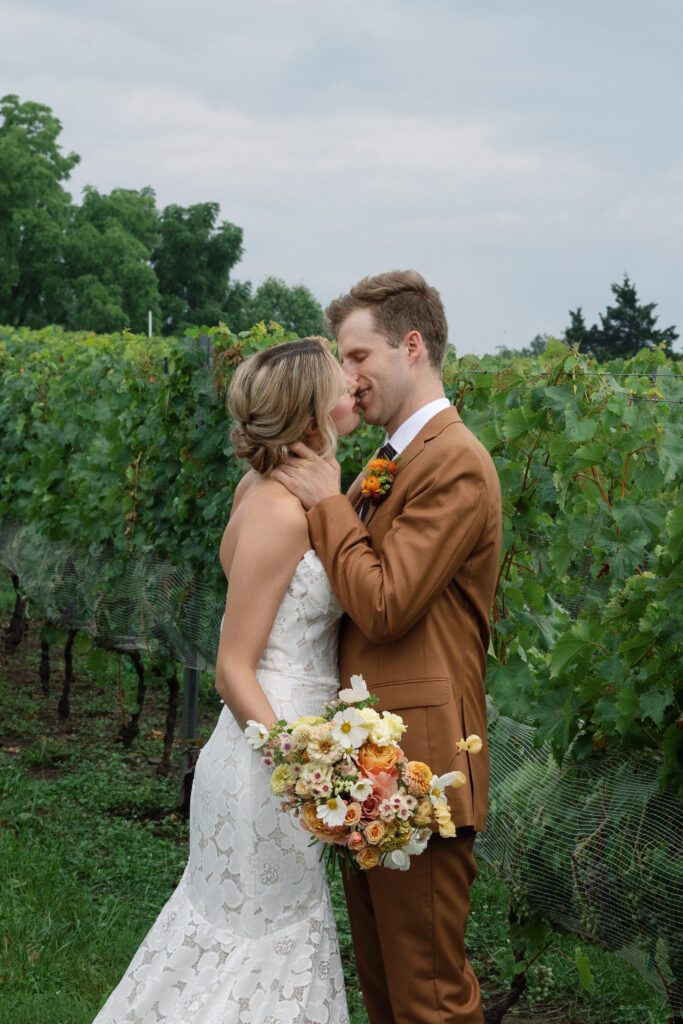 Couples wedding photos in the vines at Morias Vineyards and Winery