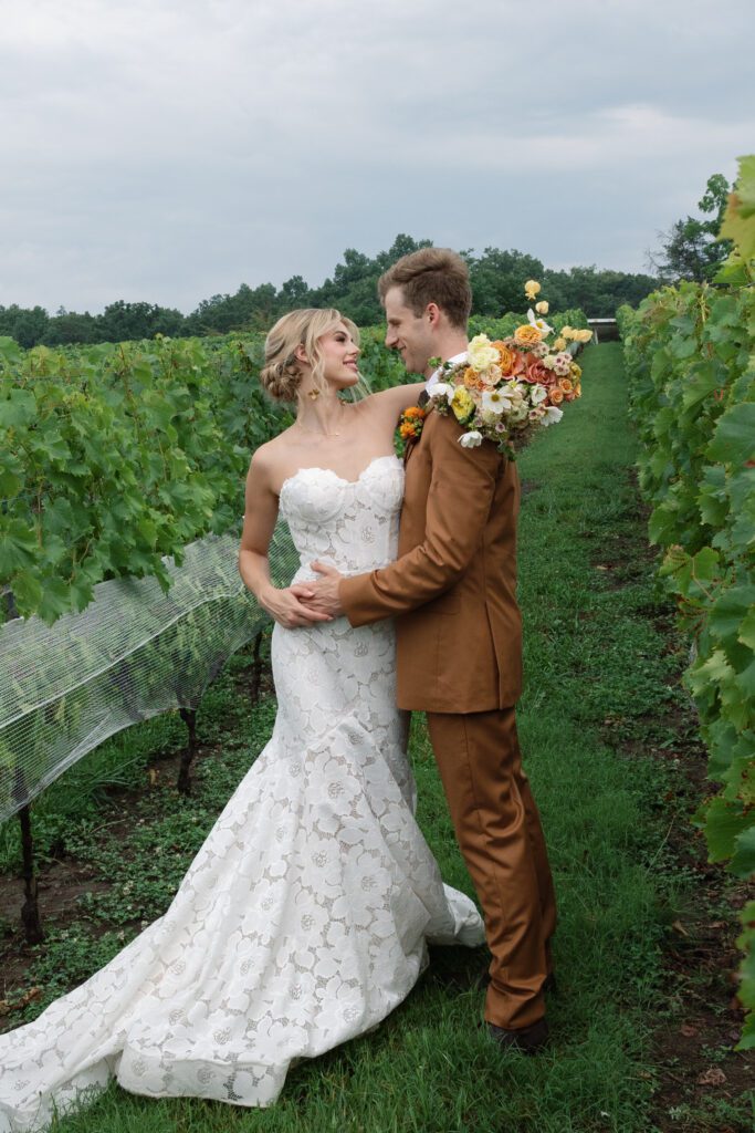 Couples wedding photos in the vines at Morias Vineyards and Winery