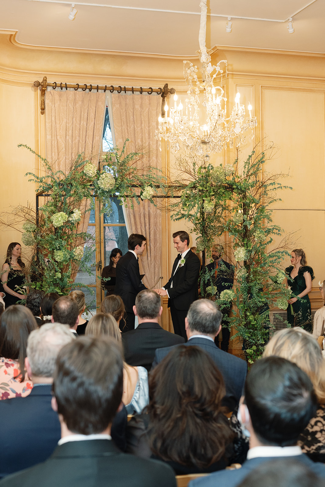 Two grooms get married under the chuppah at their Meridian House wedding ceremony 