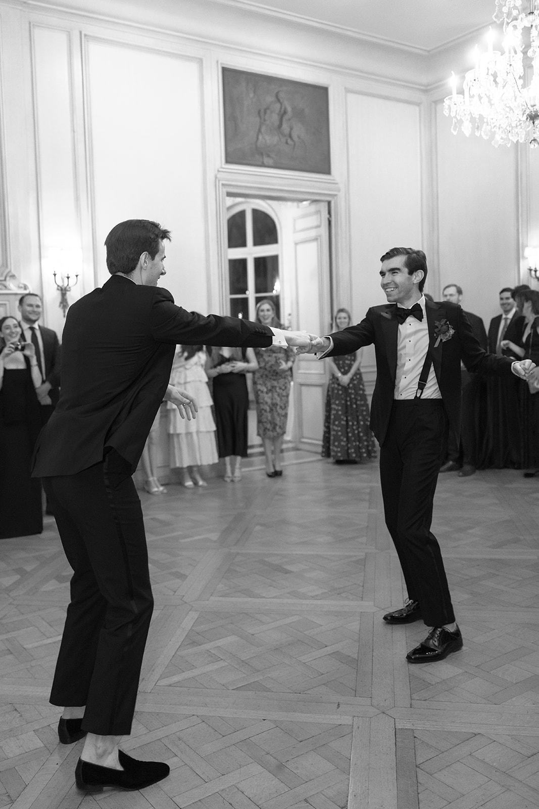 Two grooms take their first dance during their LGBTQ wedding held at Meridian House